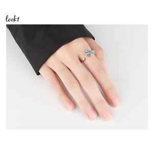 Detailed view of an adjustable butterfly fidget ring with blue zircons for anxiety relief