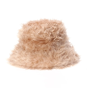 Detailed texture of plush faux fur on a warm light camel bucket hat for winter