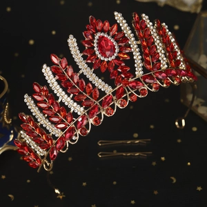 Luxurious vintage bridal crown with red gems and clear crystals on a golden alloy base