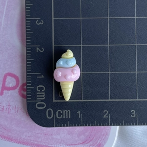 Mini resin ice cream charm for DIY crafts measuring 2.1cm by 1.1cm on a scale board