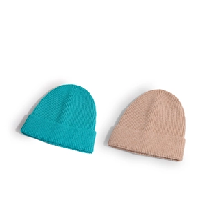 Minimalist rib-knit beanies in lake blue and light khaki with classic folded cuff design