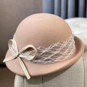 Elegant French-style camel wool dome hat with white mesh lace and a woven bow accent