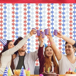 Christmas party background curtain with red and blue snowflake patterns and party decor