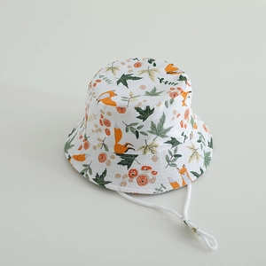 Detailed view of kids cotton bucket hat with orange fox print and adjustable chin strap
