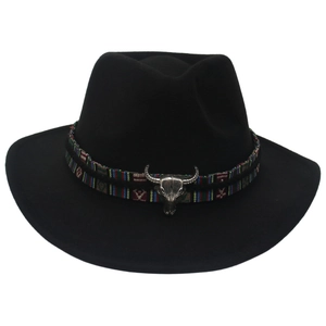 Detailed view of black felt western cowboy hat with steer skull and ethnic woven band