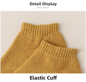 Detail view of ginger yellow cotton sport sock with elastic ribbed cuff for a snug fit