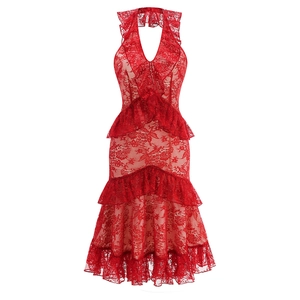 Detail of red hollow lace fabric with ruffles and halter neck design on summer dress