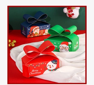 Detailed view of Christmas gift boxes with large ribbon bows and festive illustrations