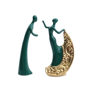 Abstract modern ceramic dance figurines in dark green and gold for home decor