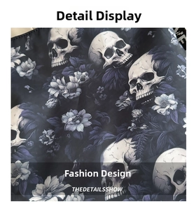 Macro detail of the gothic floral print featuring white skulls and purple flowers