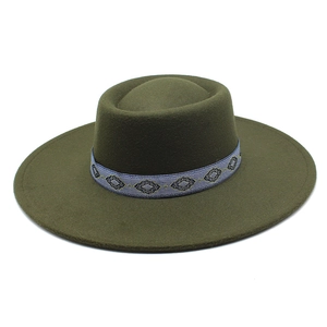 Detail of olive green wool fedora hat with ethnic embroidered geometric ribbon band