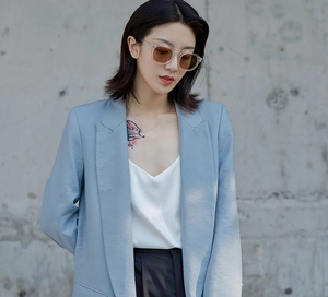 Close-up of light blue casual business suit jacket with fine texture and sharp tailoring