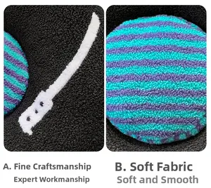Macro detail of plush record pillow showing striped fabric and sword embroidery