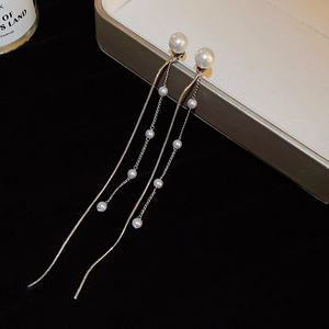 Elegant long tassel pearl earrings with gold chains and multiple white round pearls