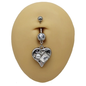 Detail view of heart belly ring with crystals and pearl on simulated skin model