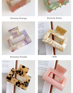 Detail shot of rectangular acetate hair claws in various marble textures and colors