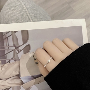 Detail of minimalist S925 silver beaded ring worn on finger for a stylish daily look