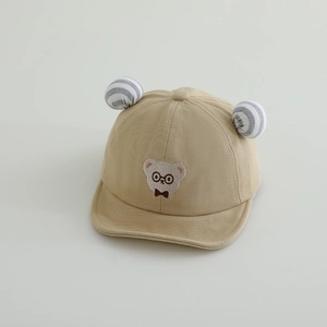 Detail of baby sun hat featuring cute bear embroidery and striped soft round ears