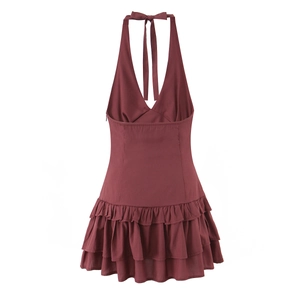 Detail view of burgundy halter backless dress with layered ruffles and hidden zipper