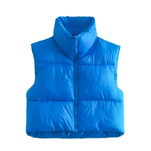 Detail of bright blue padded vest featuring a stand collar and adjustable drawstring hem