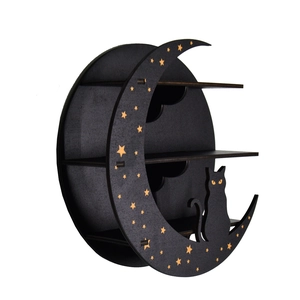 Detailed view of black crescent moon shelf with cat silhouette and golden stars
