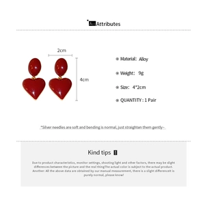 Detailed specs for oval red heart drop earrings with silver needles and alloy finish