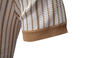 Detail of white knit polo featuring vertical bronze stripes and honeycomb breathable texture