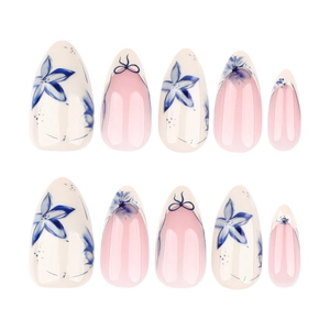 Short almond press-on nails with blue floral hand-painted art and bow designs