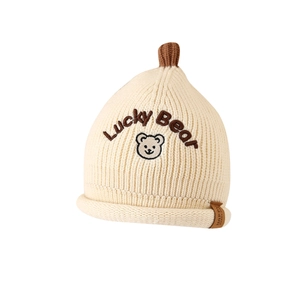 Winter infant knit hat with Lucky Bear embroidery and brown pom-pom in cream white