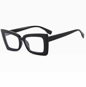 Detail view of glossy black chunky square glasses frame with sleek temples and clear lenses