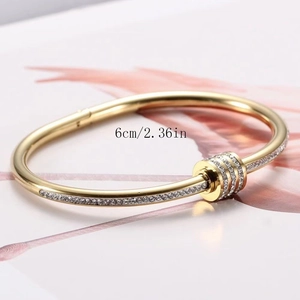 Elegant gold stainless steel bangle with sparkling crystals and 6cm inner diameter