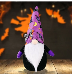 Detail of Halloween gnome featuring purple bat hat and bow on wood background