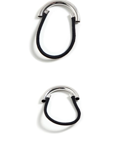 Detail view of elastic hair tie featuring a brushed silver-tone metal tube and black band