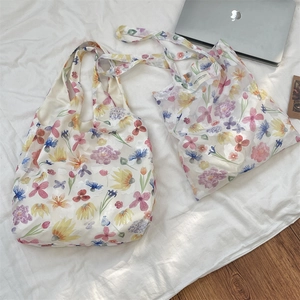 Detailed comparison of two mesh floral tote bags in large and small sizes for versatile use