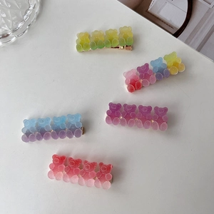 Colorful gradient gummy bear hair clips in pink, purple and blue resin material
