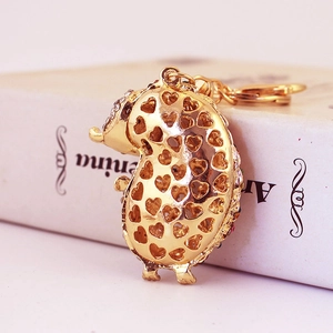 Cute crystal hedgehog keychain with gold heart cut-out and rhinestone bag charm
