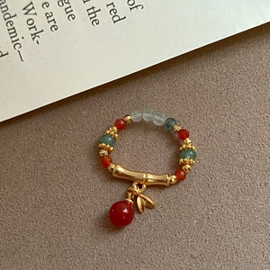 Ethnic vintage stretch ring with tiger eye agate beads and golden bamboo leaf charm
