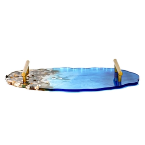 Close-up of ocean-style epoxy resin tray with blue gradient, shells and gold handles