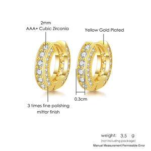 Macro detail of gold plated hoop earrings with 2mm AAA cubic zirconia inlay and polished finish