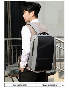 Detail of grey business laptop backpack with padded shoulder straps and USB port