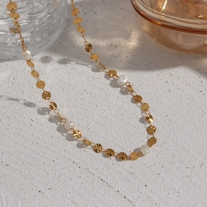 Elegant gold stainless steel necklace featuring round textured discs and white pearls