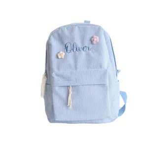 Personalized blue corduroy student backpack with Oliver embroidery and floral details