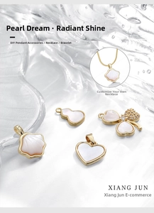 Macro detail of 18k gold plated butterfly and clover charms with mother of pearl inlay