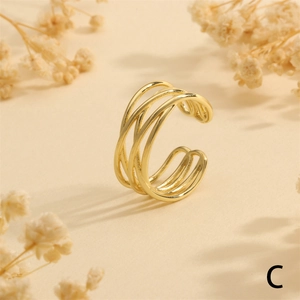 Macro shot of 18K gold plated multi-layer crisscross ring with hammered metal texture