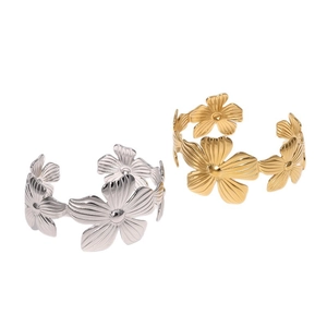 Elegant wide stainless steel open cuff bracelets with floral patterns in gold and silver