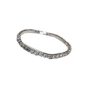 Elegant silver-toned elastic bracelet with sparkling crystal inlay on white background