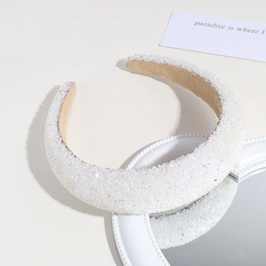 Detail of white padded headband featuring intricate pearls and colorful crystal beads