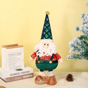 Detail of Christmas gnome plush with sequined hat and beard in festive home setting