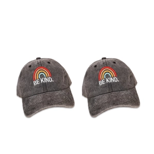 Close-up of the rainbow and BE KIND embroidery on the washed dark gray cotton baseball cap