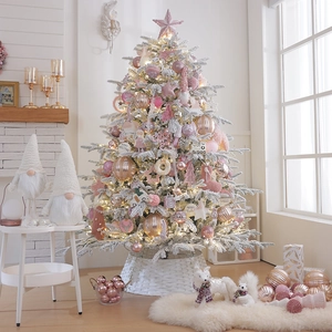 Pink and white flocked Christmas tree with luxury rose gold ornaments for home decor